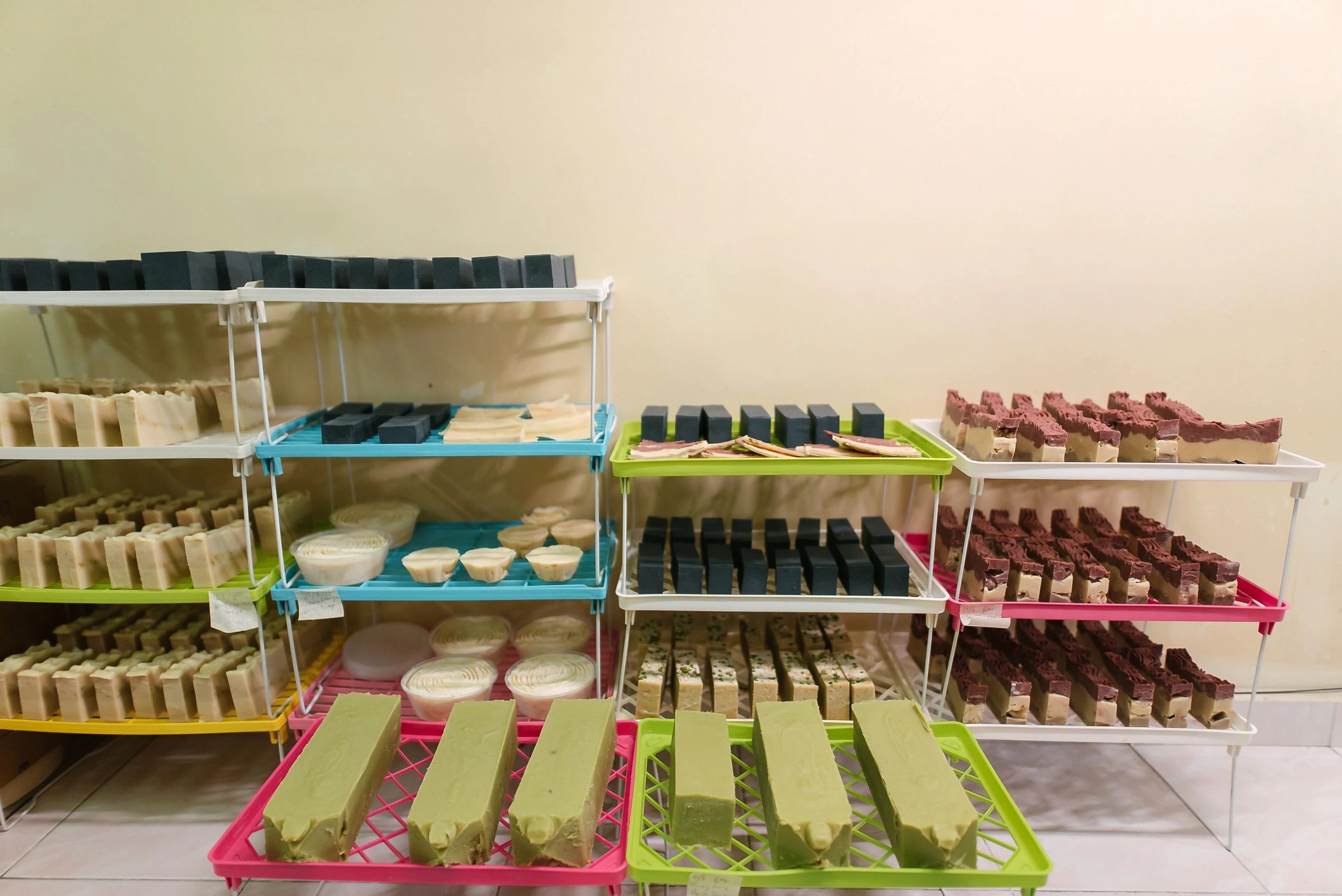 Handmade soap bars curing on a tray